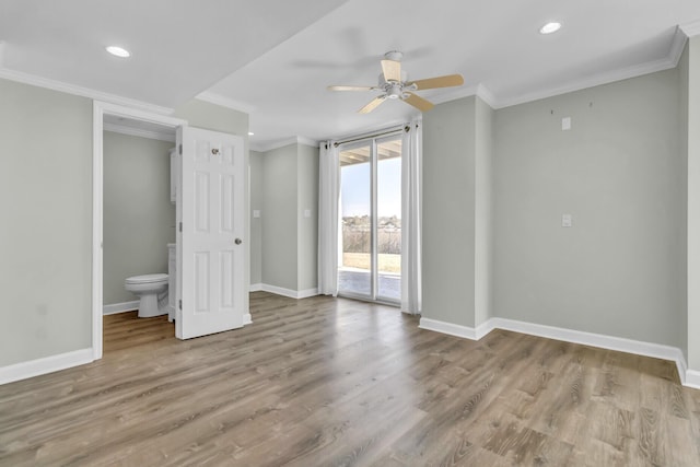 unfurnished room with crown molding and wood finished floors