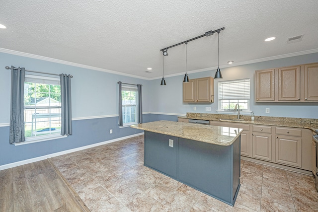 kitchen with crown molding, a center island, and hanging light fixtures