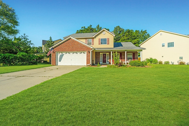 view of front of property featuring covered porch, a front yard, and a garage