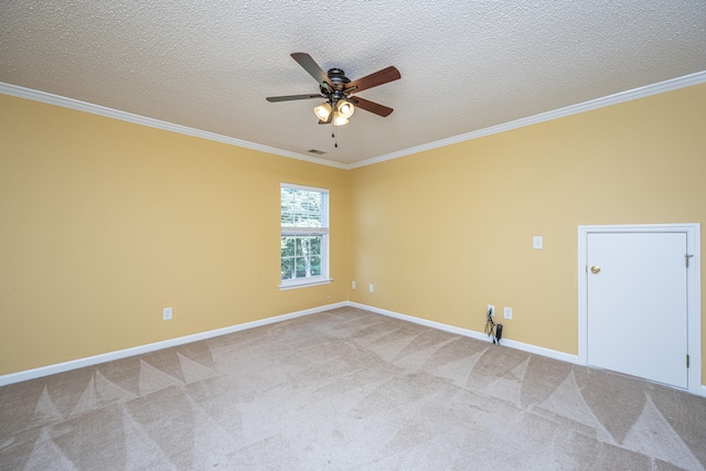 carpeted spare room featuring a textured ceiling, ceiling fan, and crown molding