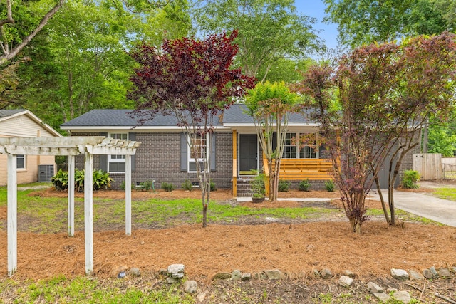 411 Berkeley Dr, Moncks Corner, SC 29461 - ranch-style house featuring a pergola, brick siding, fence, roof with shingles, and crawl space