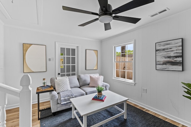 411 Berkeley Dr, Moncks Corner, SC 29461 - living area featuring wood finished floors, ornamental molding, a ceiling fan, baseboards, and attic access