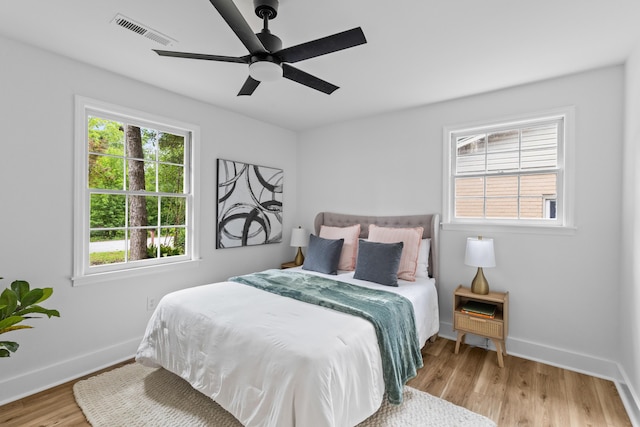 411 Berkeley Dr, Moncks Corner, SC 29461 - bedroom featuring baseboards, wood finished floors, and a ceiling fan