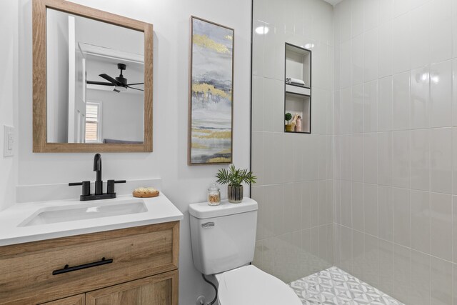 411 Berkeley Dr, Moncks Corner, SC 29461 - bathroom with toilet, ceiling fan, vanity, and a tile shower