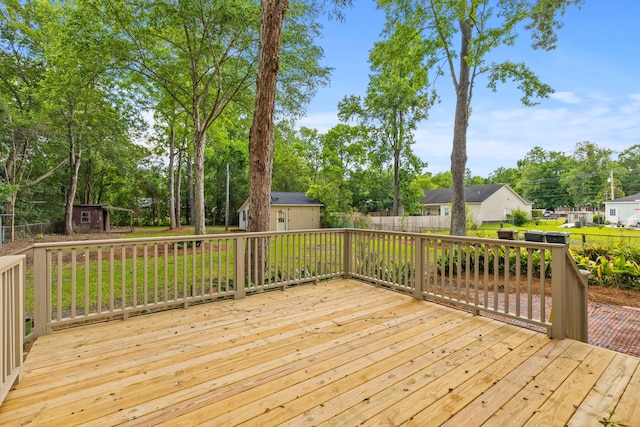 411 Berkeley Dr, Moncks Corner, SC 29461 - wooden deck with a shed, a fenced backyard, an outbuilding, and view of scattered trees