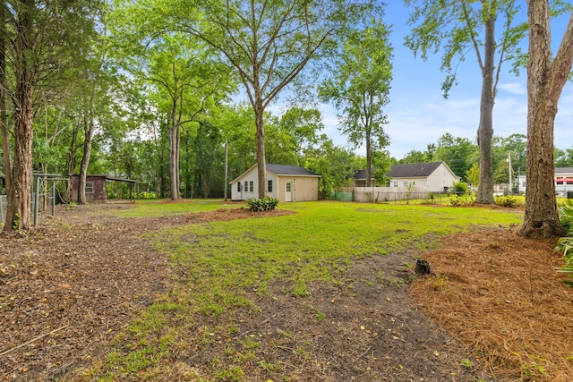 411 Berkeley Dr, Moncks Corner, SC 29461 - view of yard with view of wooded area and an outbuilding