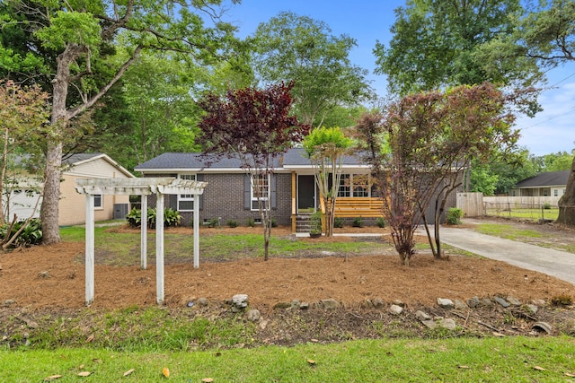 411 Berkeley Dr, Moncks Corner, SC 29461 - single story home with a pergola, fence, concrete driveway, and brick siding