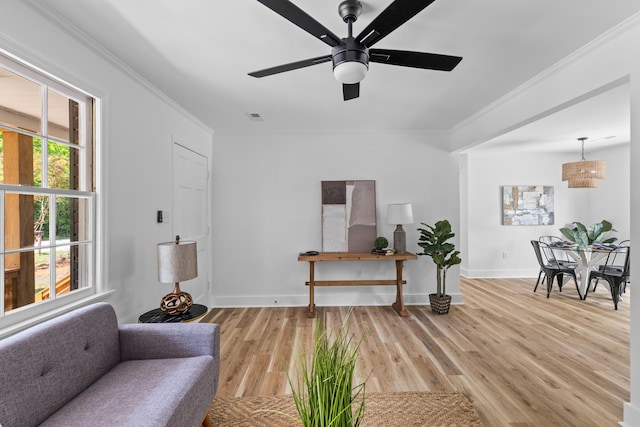 411 Berkeley Dr, Moncks Corner, SC 29461 - living area with ornamental molding, light wood-type flooring, ceiling fan, and baseboards