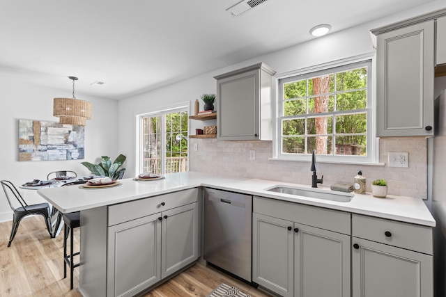 411 Berkeley Dr, Moncks Corner, SC 29461 - kitchen featuring gray cabinets, stainless steel dishwasher, a sink, a peninsula, and open shelves