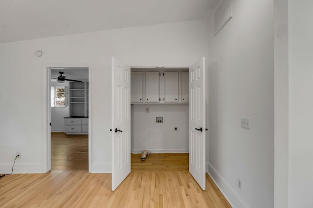 laundry area with gas dryer hookup, hardwood / wood-style floors, cabinets, hookup for a washing machine, and electric dryer hookup