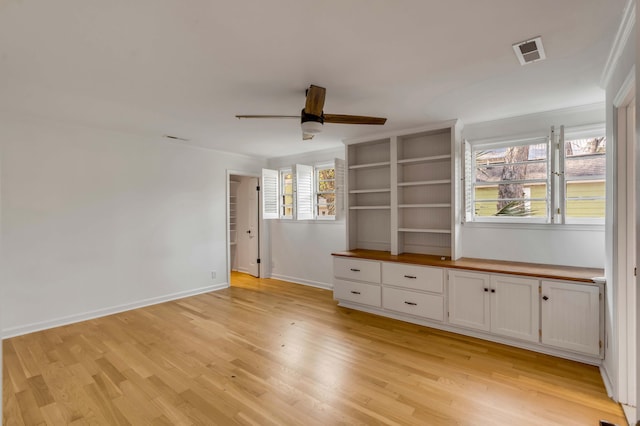 interior space with ceiling fan and light hardwood / wood-style flooring