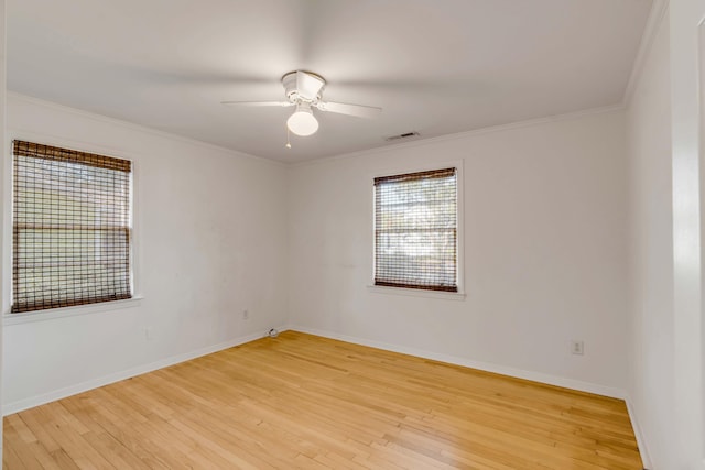 unfurnished room with ceiling fan, ornamental molding, and light hardwood / wood-style floors