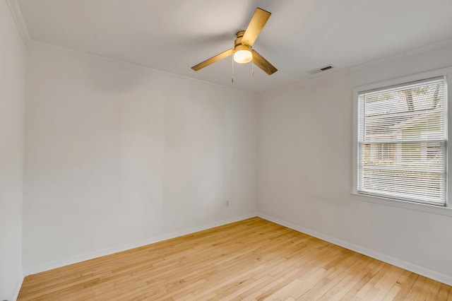 spare room featuring crown molding, ceiling fan, and light hardwood / wood-style floors