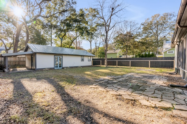 view of yard featuring french doors