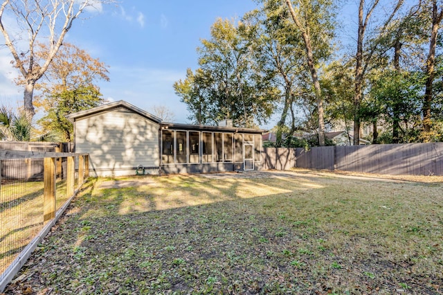 view of yard featuring a sunroom