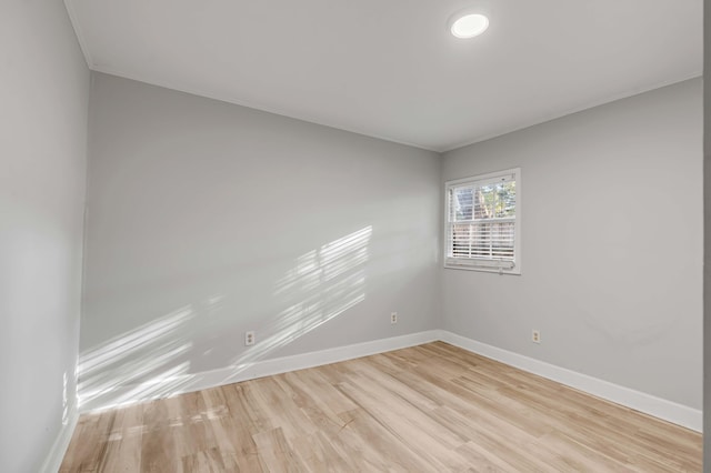 spare room featuring light hardwood / wood-style flooring