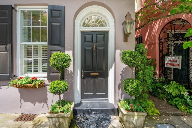 71 E Bay St, Charleston, SC 29401 - view of exterior entry featuring stucco siding