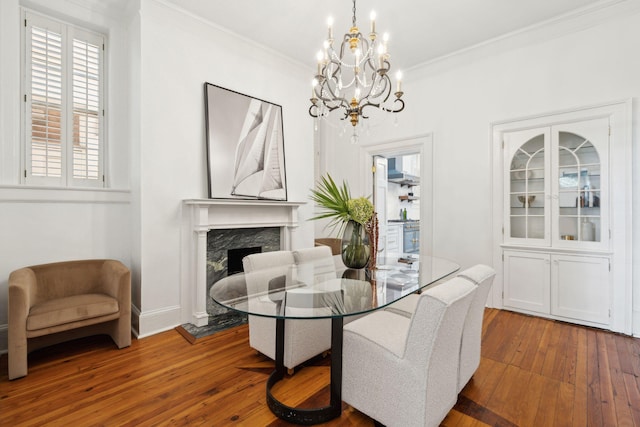 71 E Bay St, Charleston, SC 29401 - dining room featuring a chandelier, hardwood / wood-style floors, a premium fireplace, ornamental molding, and baseboards