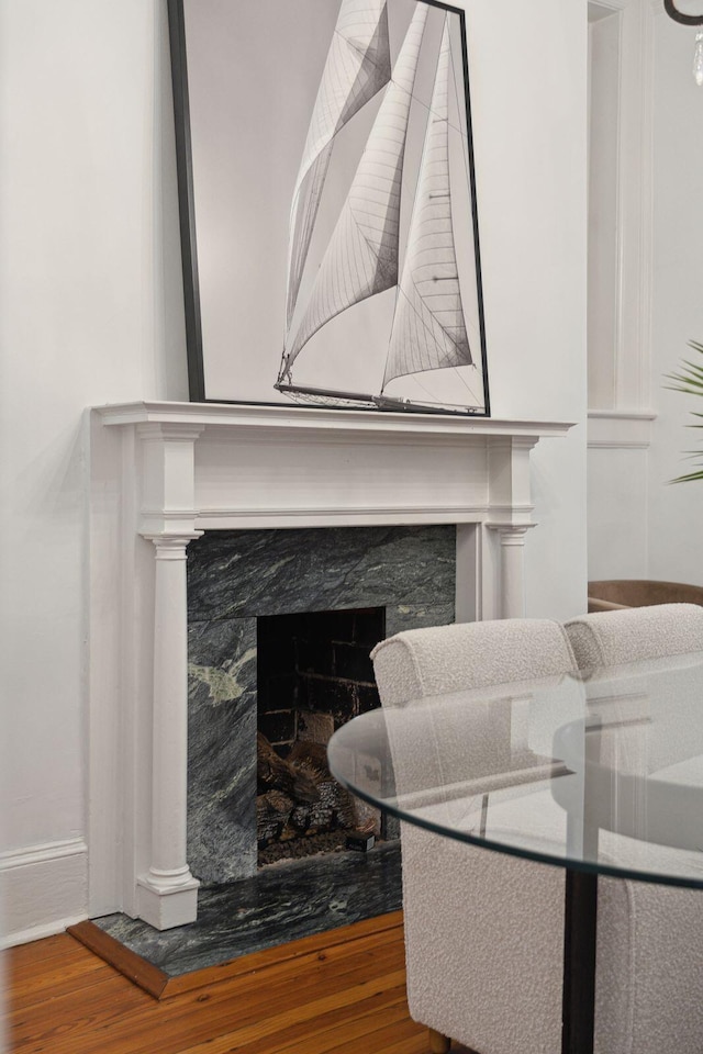 71 E Bay St, Charleston, SC 29401 - detailed view of wood finished floors, baseboards, and a premium fireplace