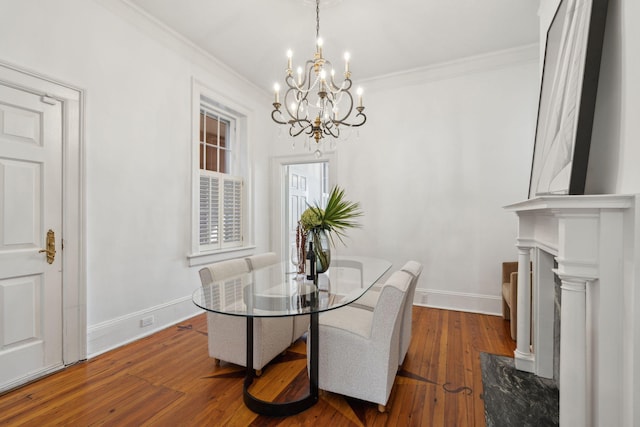 71 E Bay St, Charleston, SC 29401 - dining area featuring a chandelier, crown molding, baseboards, and hardwood / wood-style flooring