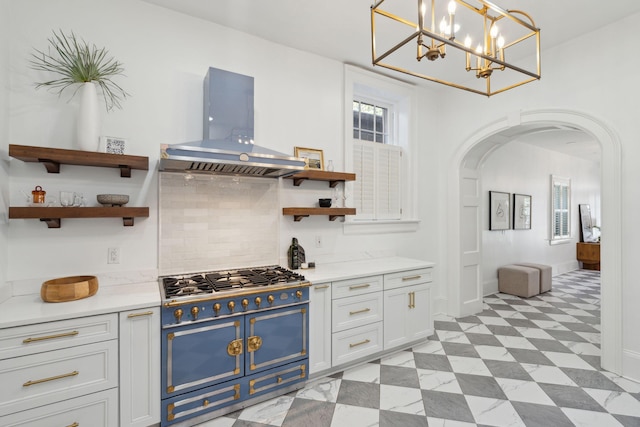 71 E Bay St, Charleston, SC 29401 - kitchen with range with gas stovetop, island range hood, open shelves, arched walkways, and tasteful backsplash