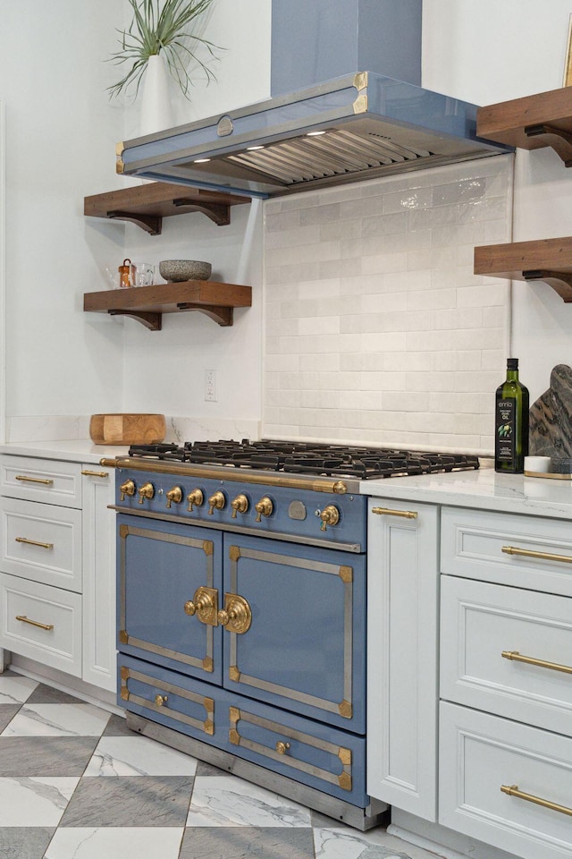 71 E Bay St, Charleston, SC 29401 - kitchen with open shelves, gas range, extractor fan, and decorative backsplash
