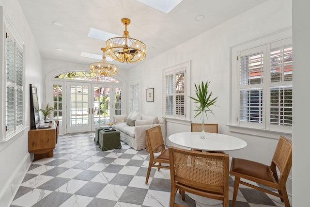 71 E Bay St, Charleston, SC 29401 - dining room with a chandelier, healthy amount of natural light, and baseboards