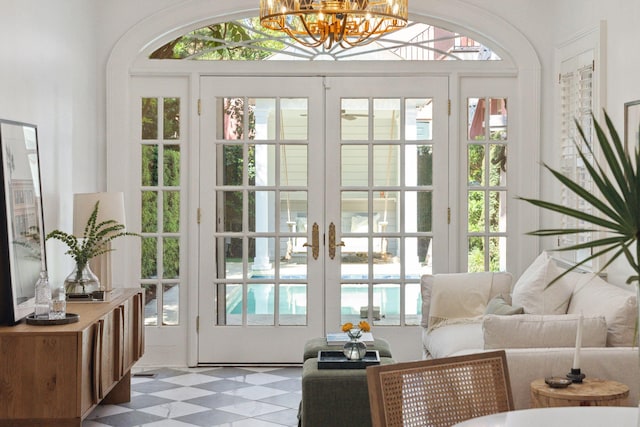 71 E Bay St, Charleston, SC 29401 - entryway featuring a chandelier, tile patterned floors, french doors, and arched walkways