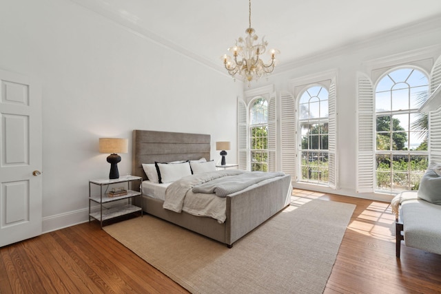 71 E Bay St, Charleston, SC 29401 - bedroom featuring ornamental molding, a chandelier, wood finished floors, and baseboards