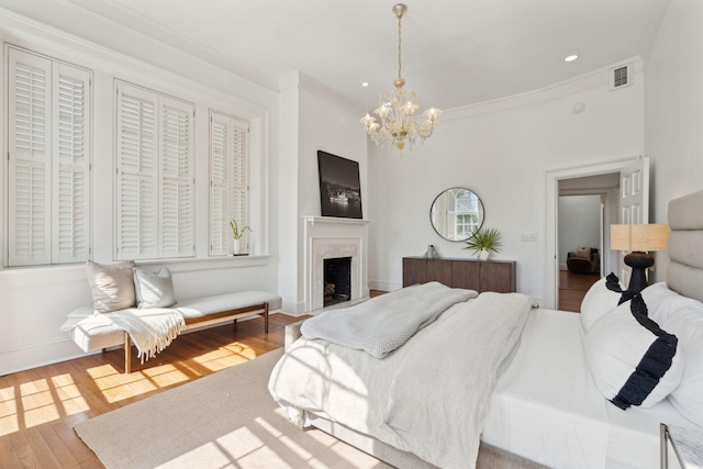 71 E Bay St, Charleston, SC 29401 - bedroom with a chandelier, ornamental molding, wood finished floors, a premium fireplace, and recessed lighting