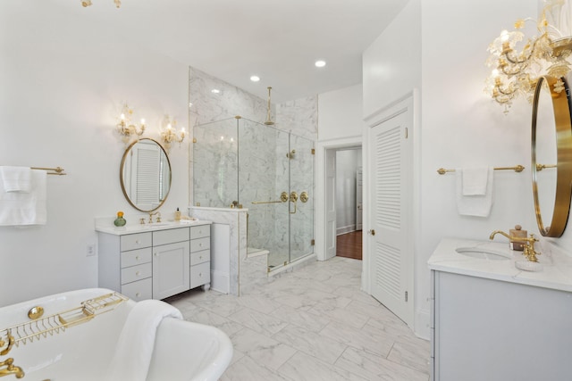 71 E Bay St, Charleston, SC 29401 - bathroom featuring a marble finish shower, marble look tiles, two vanities, a freestanding tub, and recessed lighting