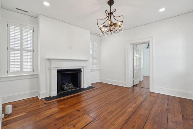 71 E Bay St, Charleston, SC 29401 - unfurnished living room with baseboards, hardwood / wood-style floors, a fireplace with flush hearth, a chandelier, and recessed lighting