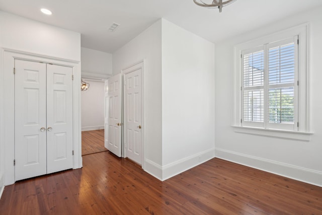 71 E Bay St, Charleston, SC 29401 - unfurnished bedroom with dark wood-type flooring, baseboards, recessed lighting, and a closet