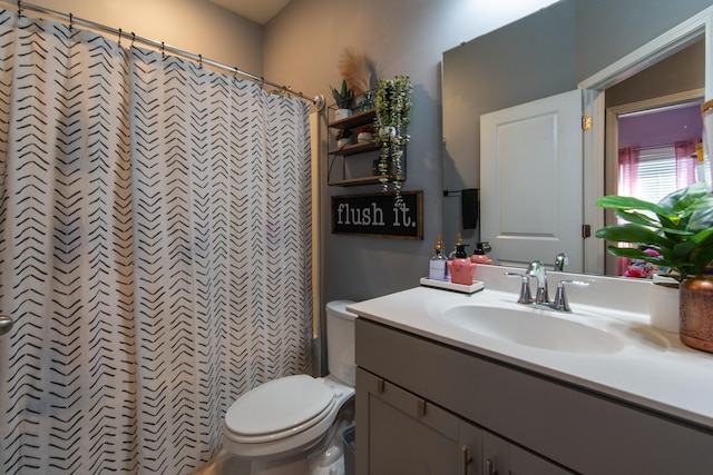 bathroom with vanity and toilet