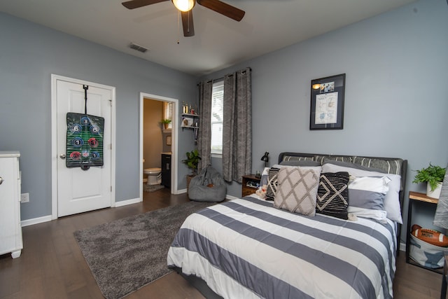 bedroom featuring ceiling fan, ensuite bathroom, and dark wood-type flooring