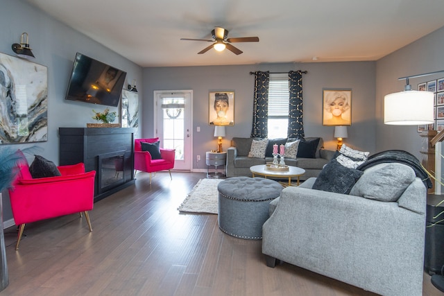 living room featuring dark hardwood / wood-style floors and ceiling fan