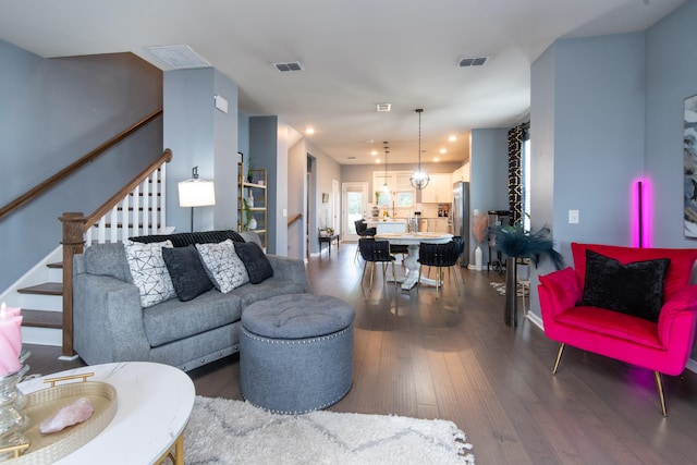 living room featuring dark wood-type flooring