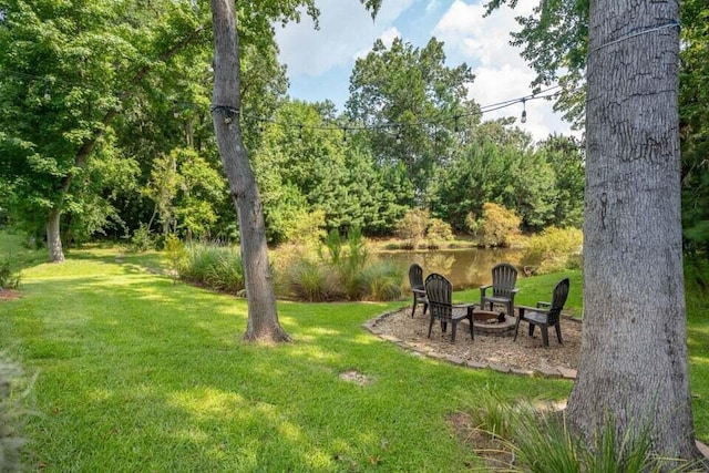 view of yard with a patio area and a fire pit