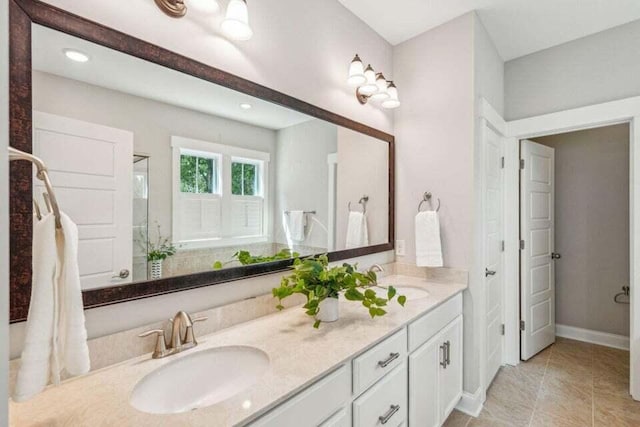 bathroom with tile patterned flooring and vanity