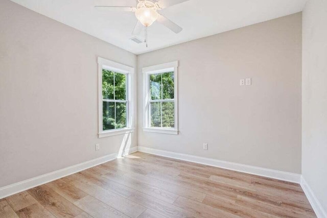 empty room with light hardwood / wood-style floors and ceiling fan