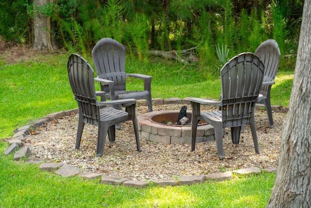 view of patio / terrace featuring an outdoor fire pit