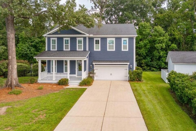 view of front facade featuring a garage, a front yard, and covered porch