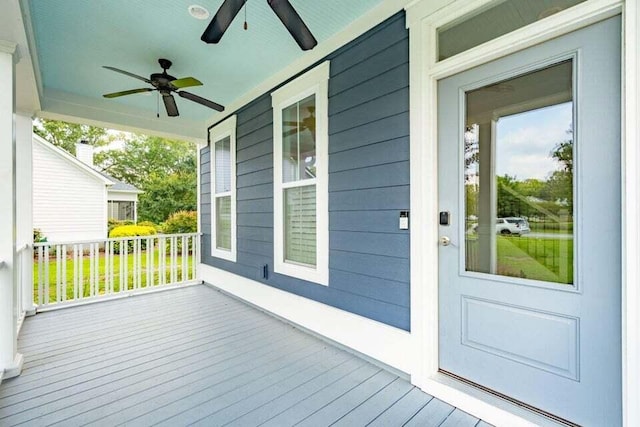 wooden terrace with ceiling fan