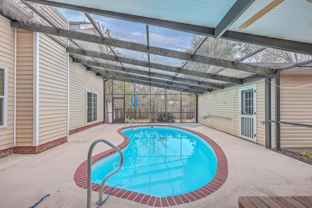 view of pool featuring a patio and glass enclosure