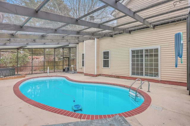 view of swimming pool featuring a lanai and a patio