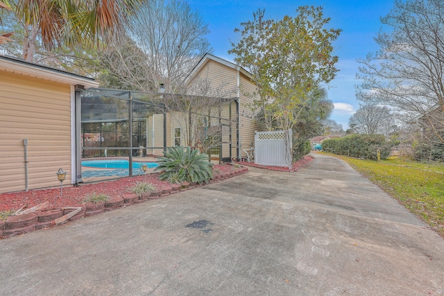 view of patio / terrace featuring a lanai