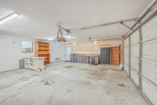 garage with cooling unit and a garage door opener