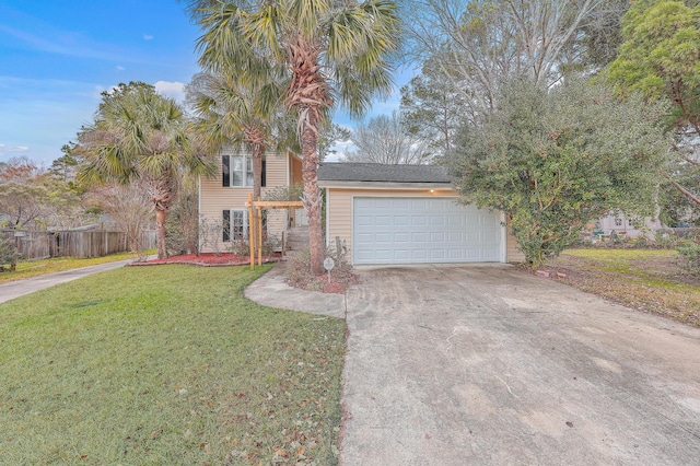 view of front of home with a garage and a front lawn