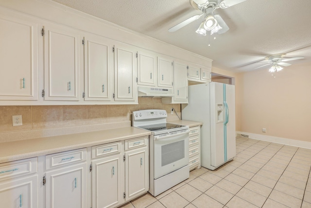 kitchen featuring white appliances, a textured ceiling, tasteful backsplash, light tile patterned flooring, and white cabinetry