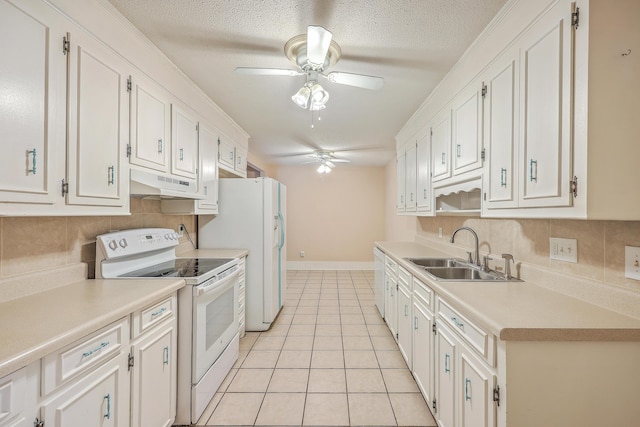 kitchen with white appliances, sink, ceiling fan, light tile patterned flooring, and white cabinetry